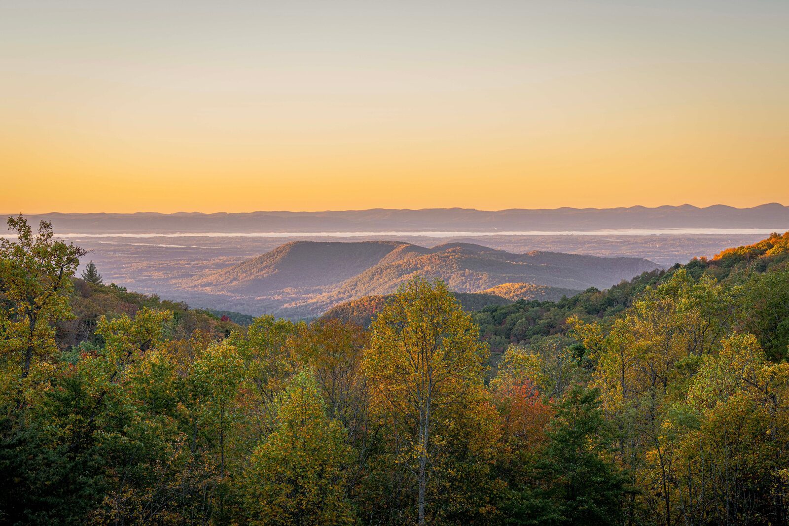Sunrise over forested Blue Ridge ridges in early fall